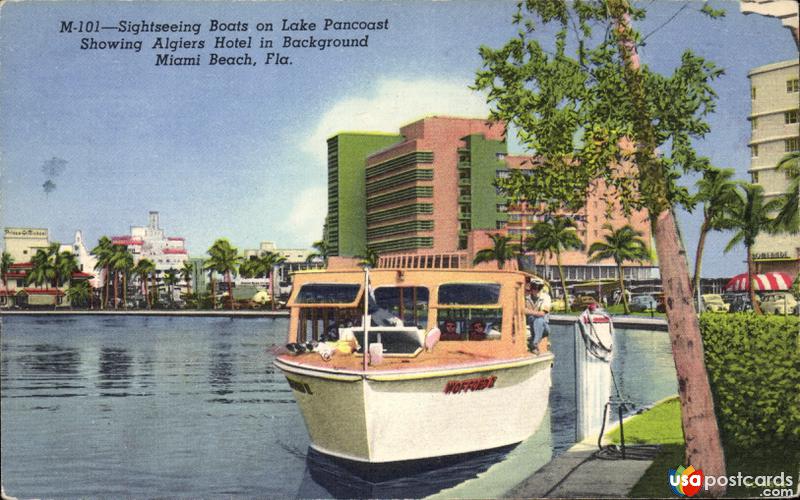 Sightseeing boats on Lake Pancoast, showing Algiers hotel in background